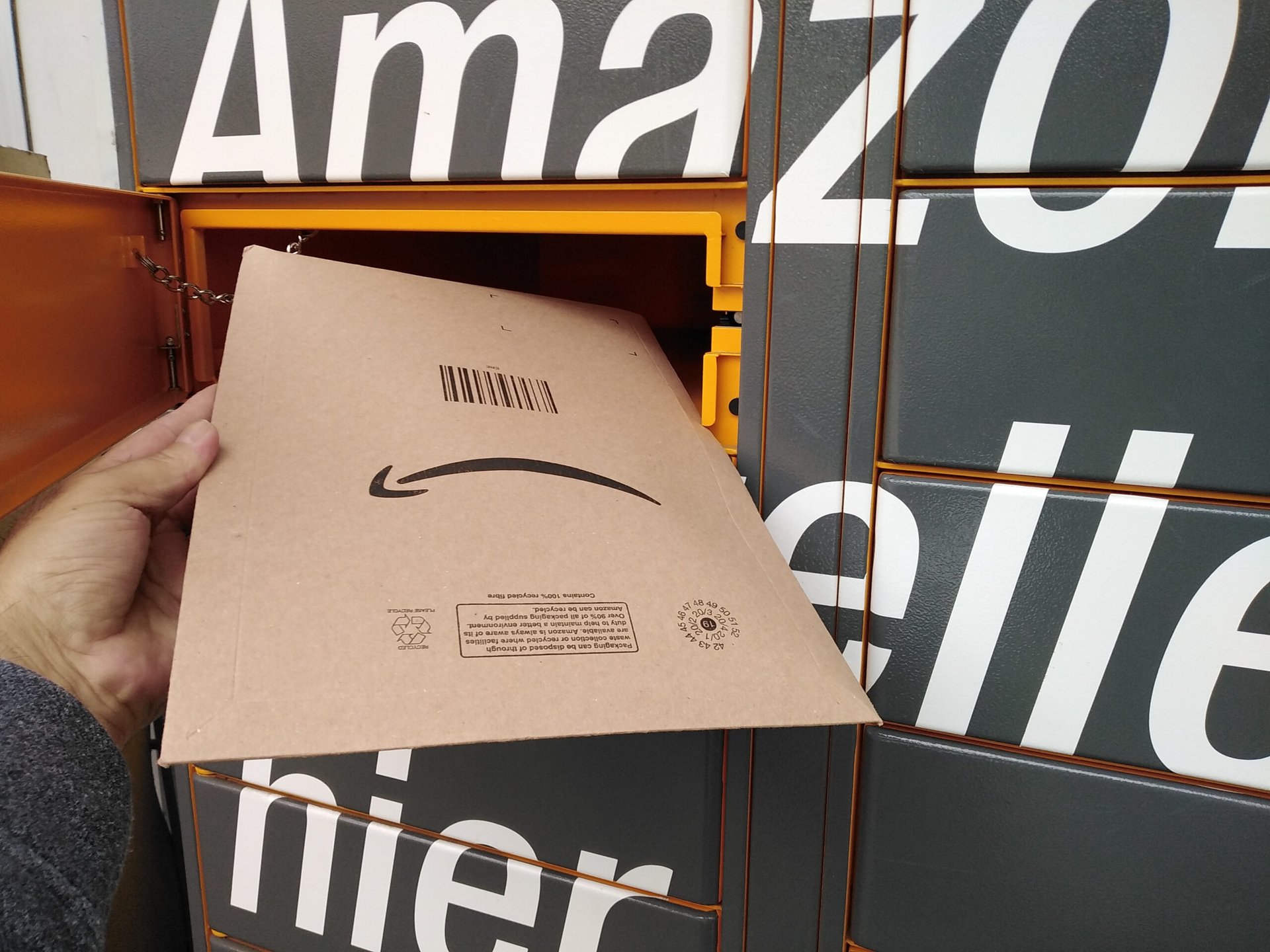 Amazon package being retrieved or returned to an Amazon locker with a frown