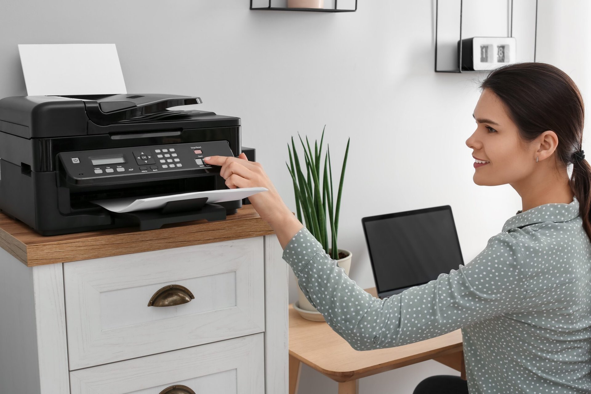 Someone Using The Printer These Printers Won’t Cost You a Fortune in Ink