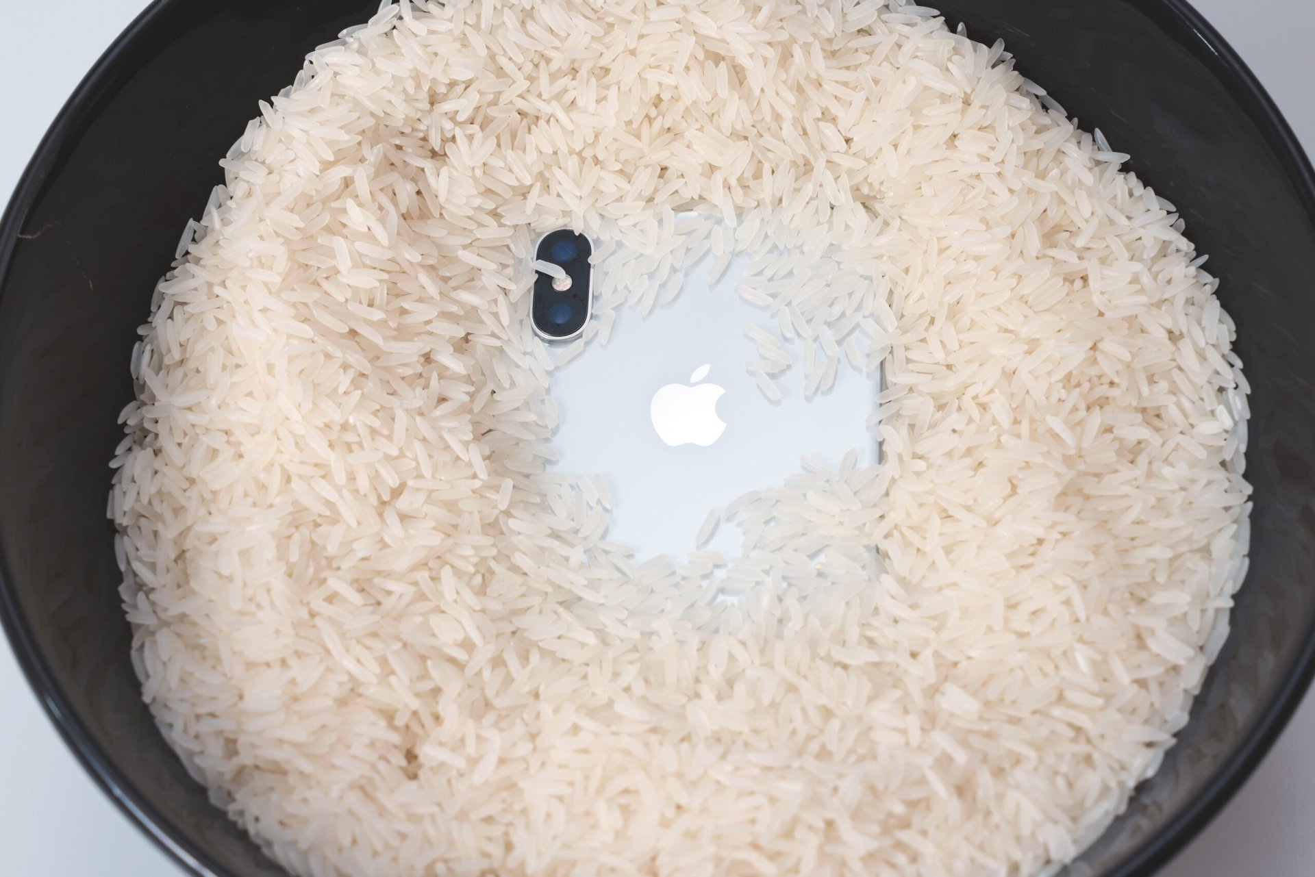 iPhone in a bowl of dry rice