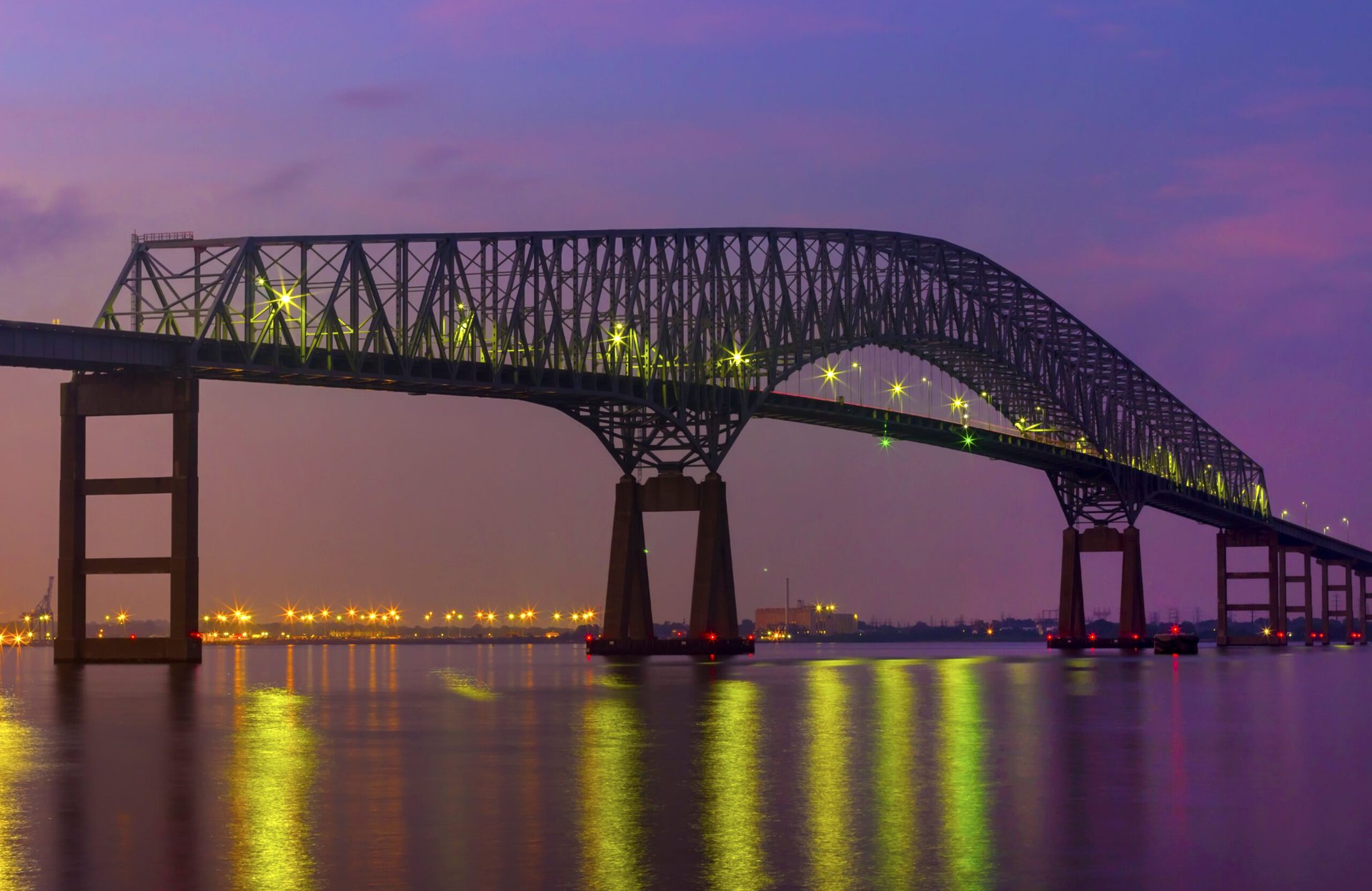 Francis Scott Key bridge with Baltimore skyline at night