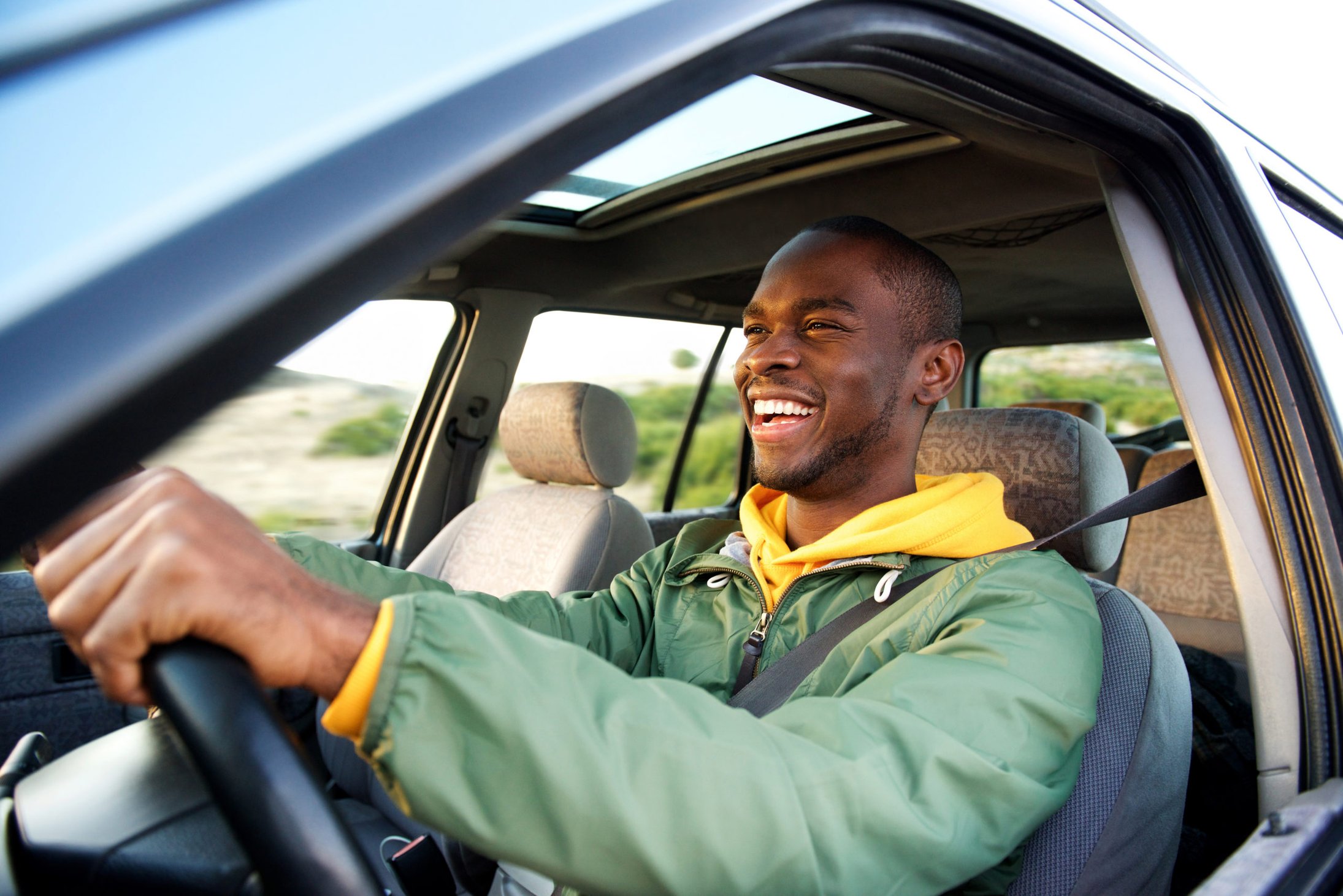 man driving a car