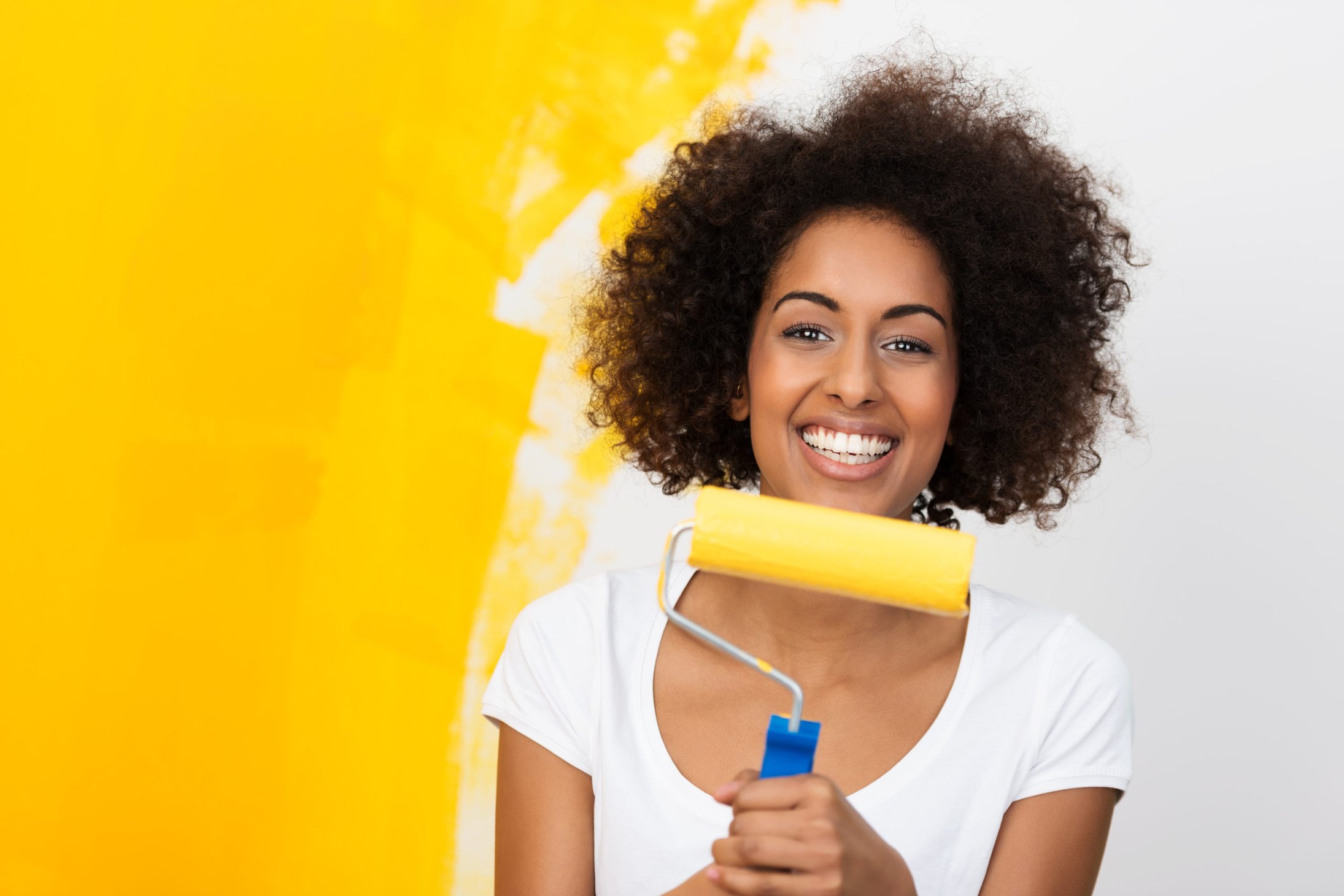 woman painting her home