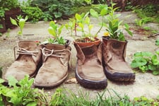 Old shoe planters for outdoor garden with reusable materials
