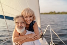 Happy retired couple on a boat