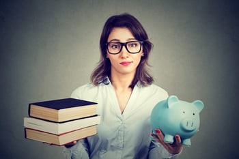 Young woman considering student loans for college savings