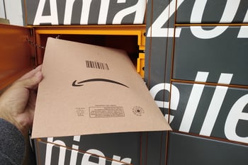 Amazon package being retrieved or returned to an Amazon locker with a frown