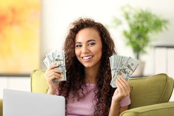 Young woman holding money