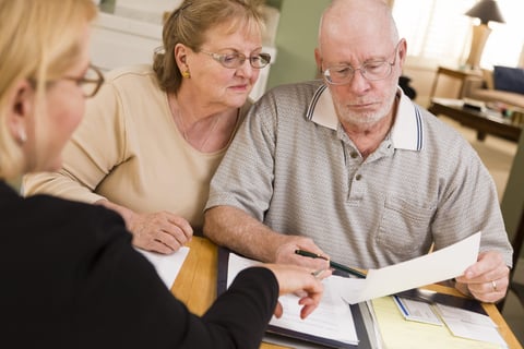 Senior couple writing a will