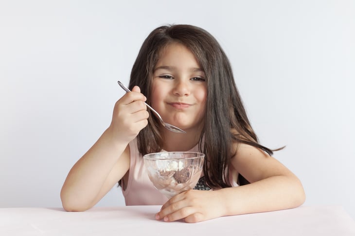 Child eating a bowl of ice cream