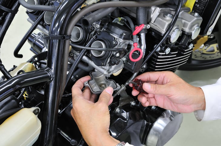 Motorcycle being repaired.