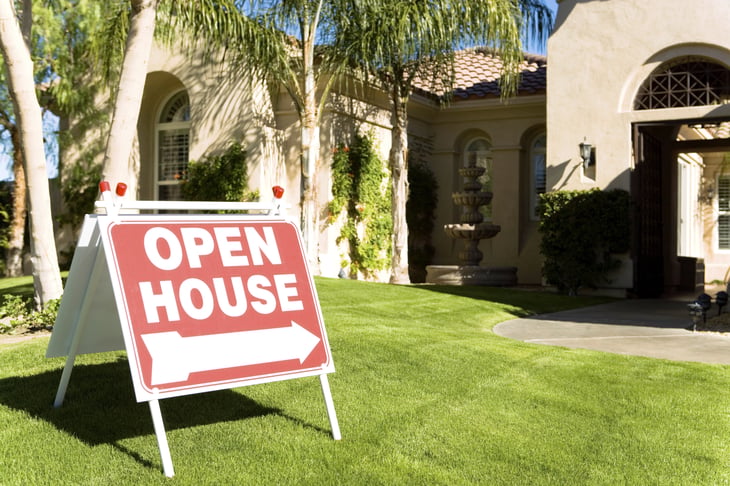 Home with Open House sign in yard.