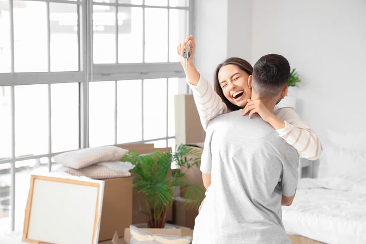Happy couple moving into a new home