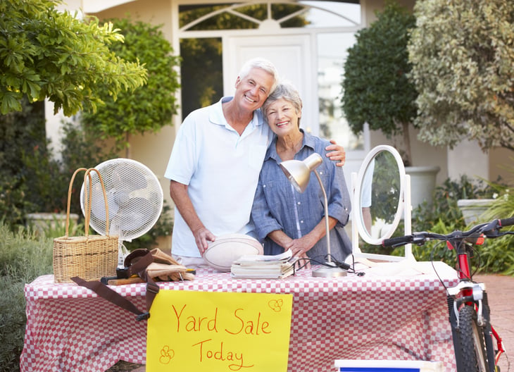 A couple hosts a yard sale