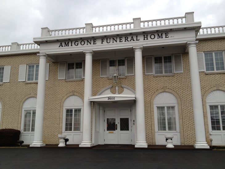 Large Building with the Name Amigone Funeral Home.
