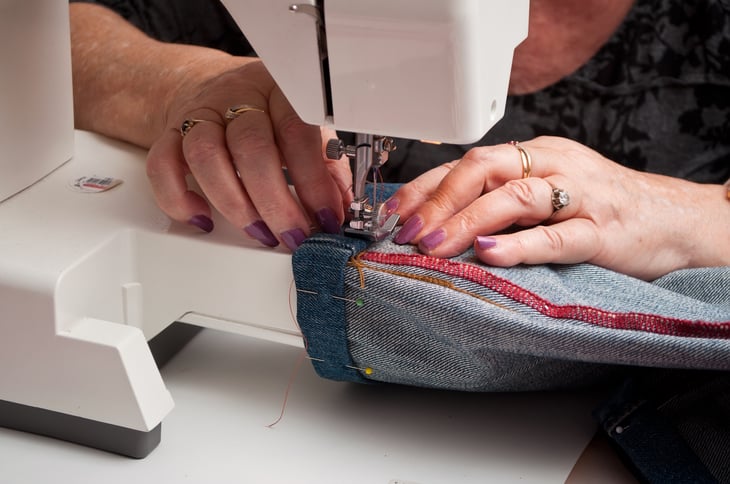 Close up of person sewing