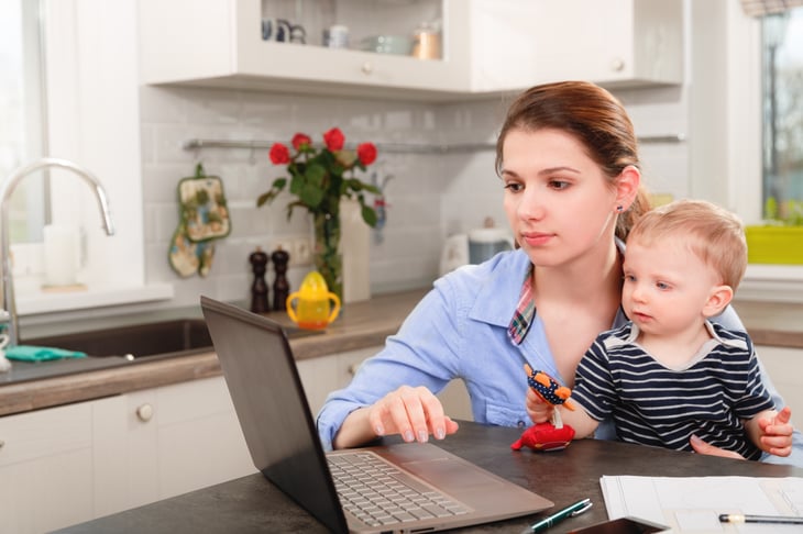Woman and child in front of a laptop