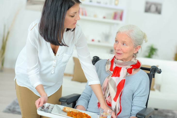 Girl Serving Old Woman