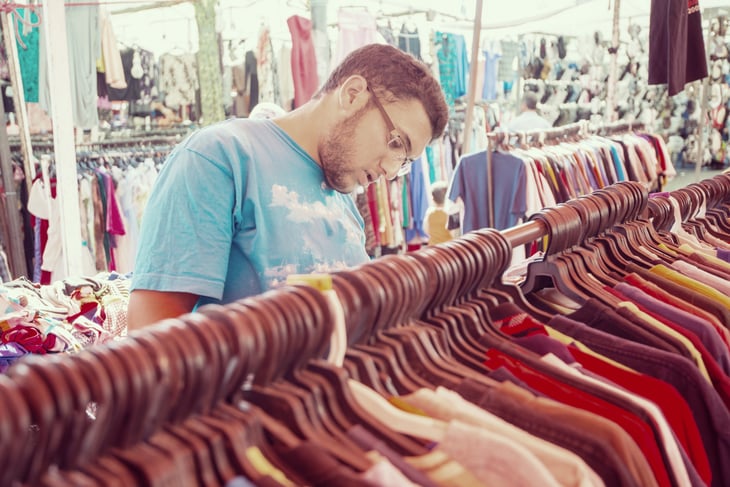 Young man in a consignment shop