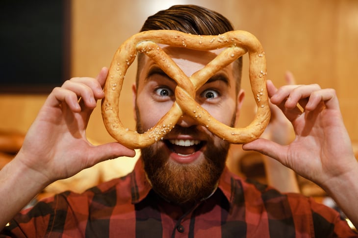 Man holding pretzel