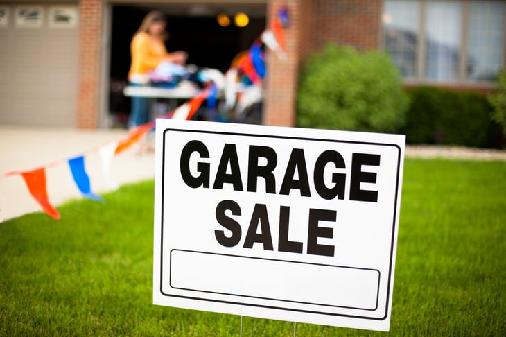 Garage sale sign in yard
