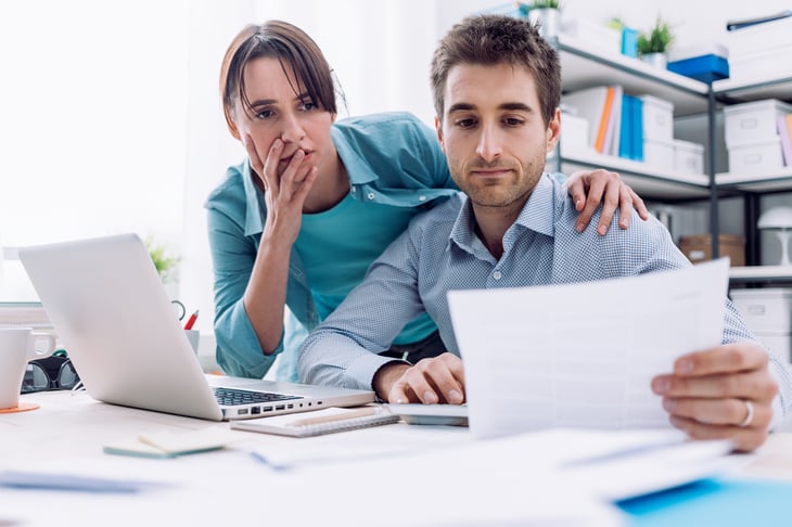 Couple looking at bills.