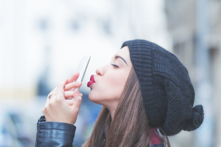 girl holding on to phone