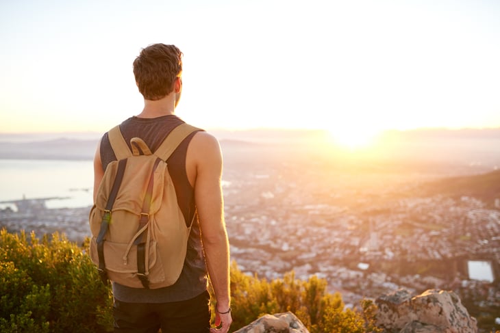 A traveler takes in a view