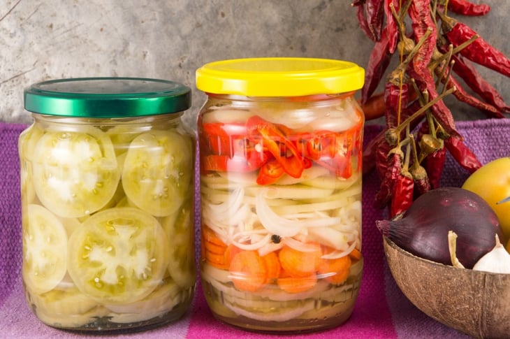 Jars with pickled veggies inside.