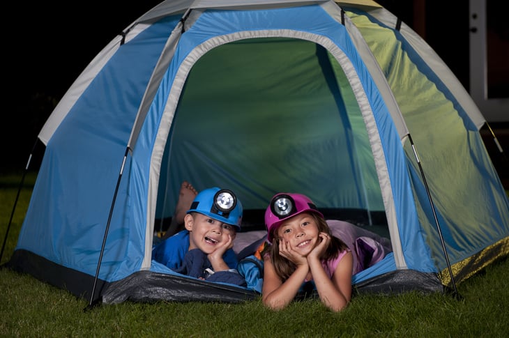 If you have a tent and some sleeping bags, you can give your kids a taste of the camping experience just by setting it up in the back yard.