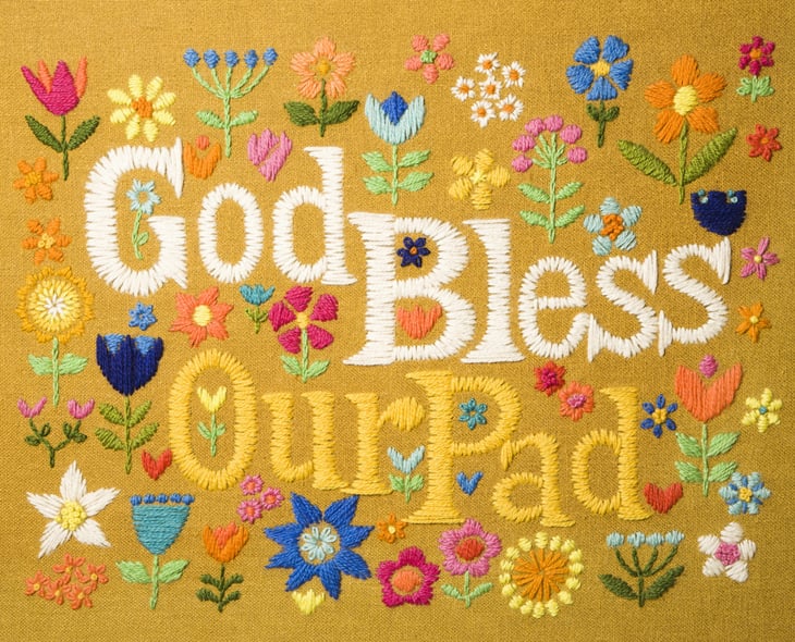 Needlepoint "God Bless Our Pad" hanging.