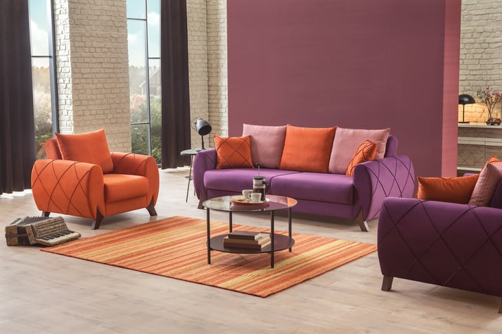 Purple and orange living room furniture set.