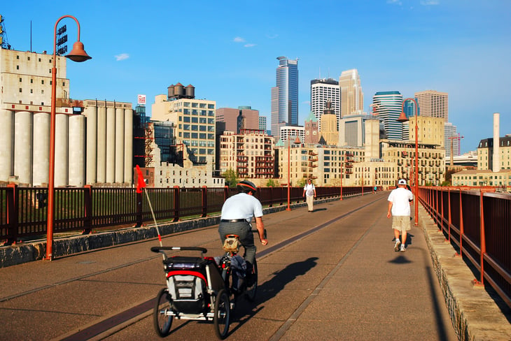 Minneapolis bridge with bikers, runners.