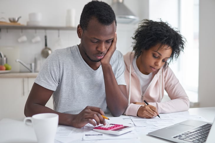 Black couple budgeting together