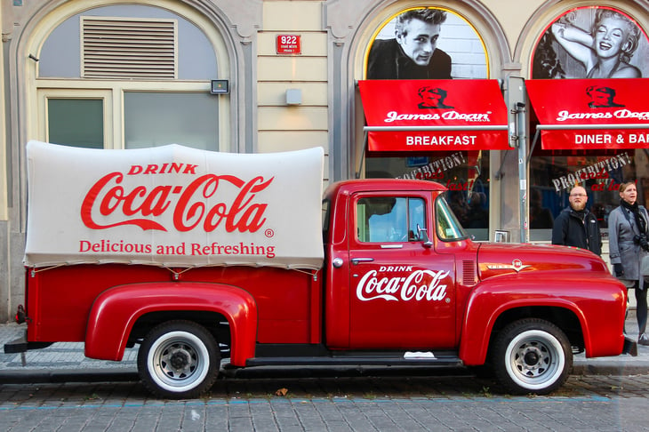 Old fashioned CocaCola pickup truck on a city street