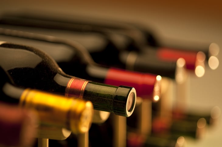 Bottles of wine stored on a rack.