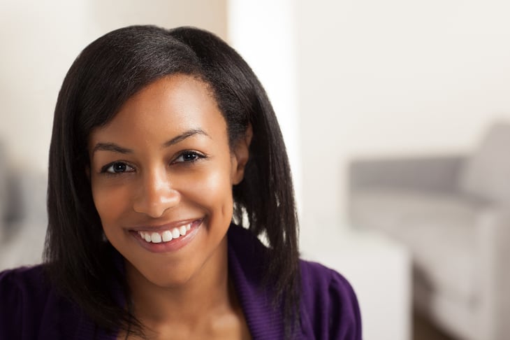 Smiling African American woman, head shot.