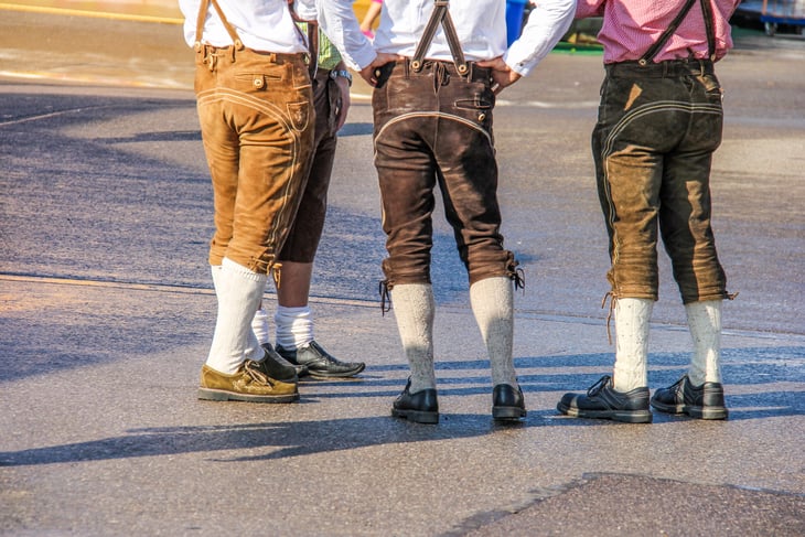 Three men wearing lederhosen.