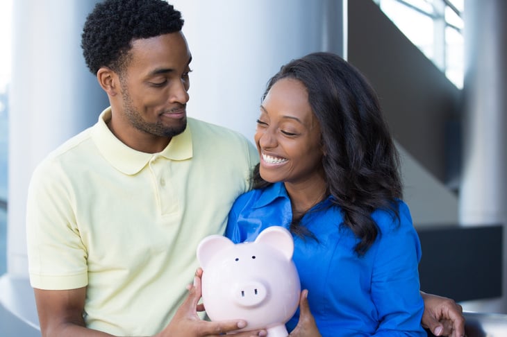 Happy couple with money