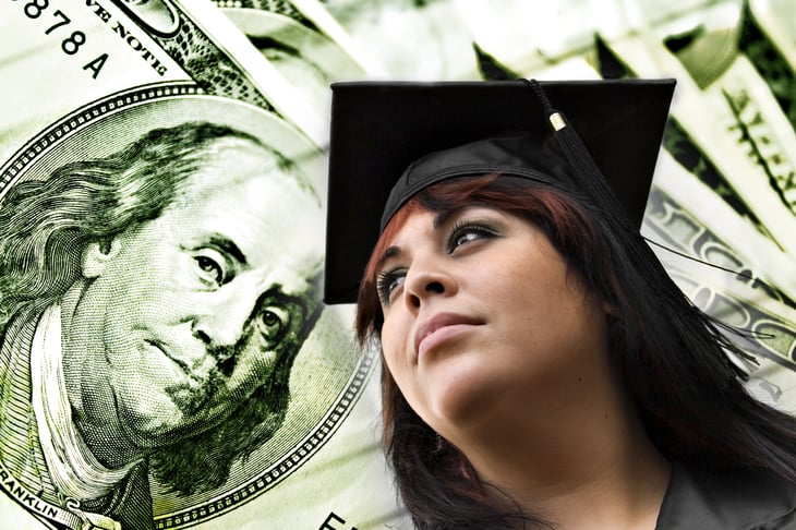 College grad with $100 bills in background.