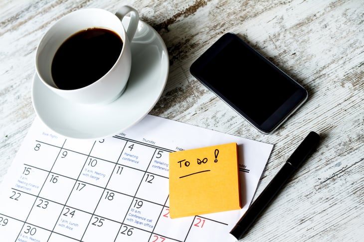 Calendar, phone, to-do note, pen and coffee