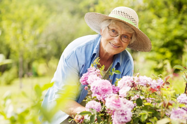 Retired woman gardening
