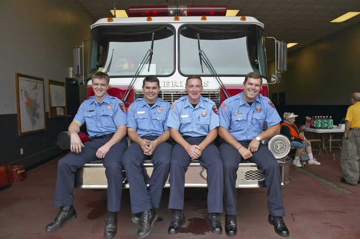 Firefighters on a firetruck in Americus, Georgia