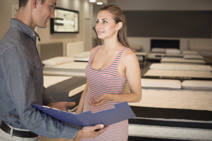 Woman in mattress store