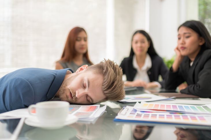Man asleep at meeting.