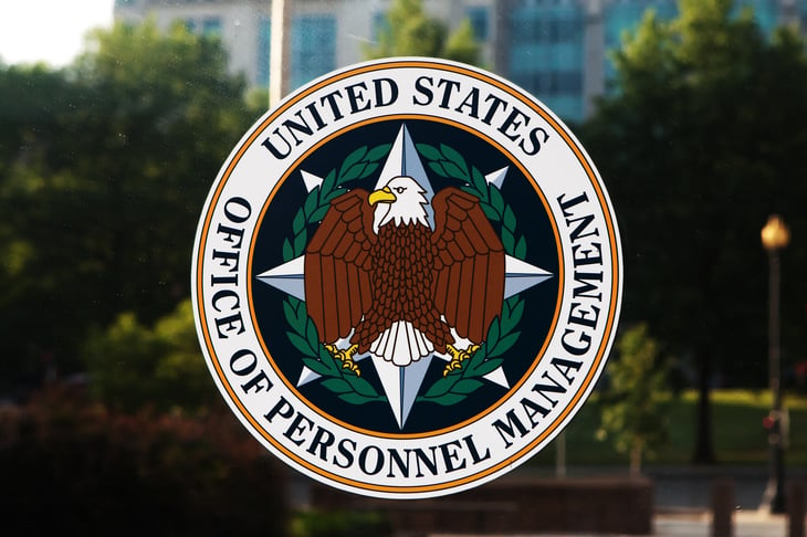 Office of Personnel Management seal on glass door.
