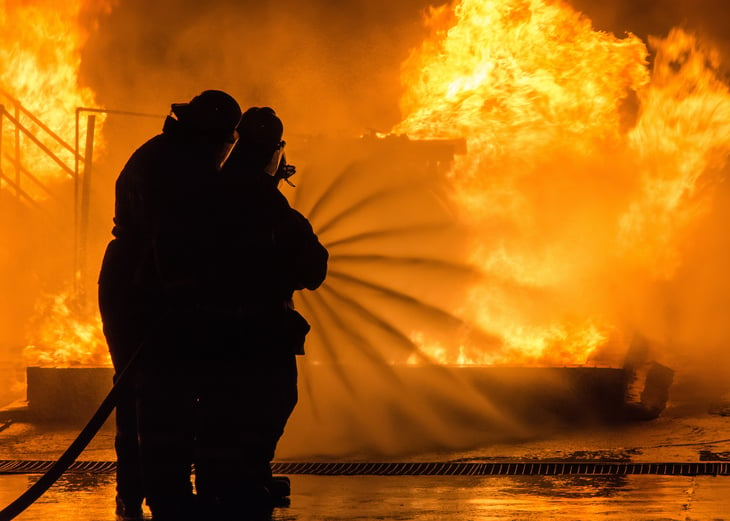 Firefighters extinguishing blaze