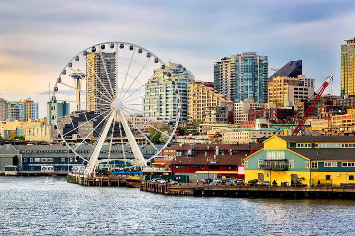 Seattle waterfront with ferris wheel and Space Needle.