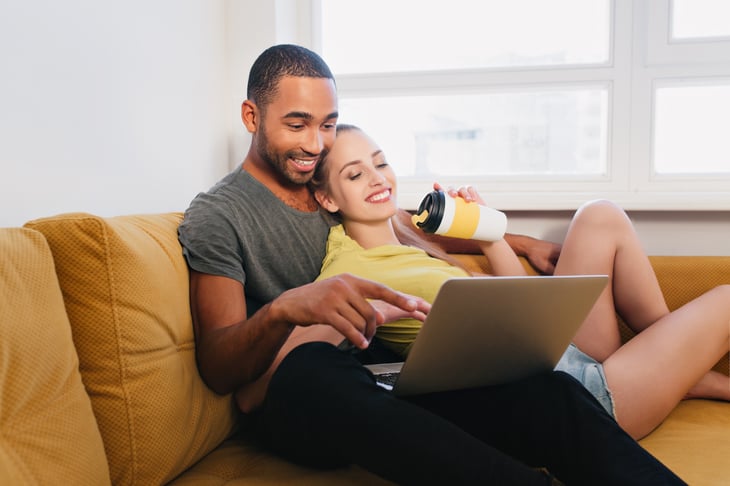Couple watching something on a laptop