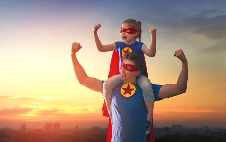 Father and daughter dressed as super heroes