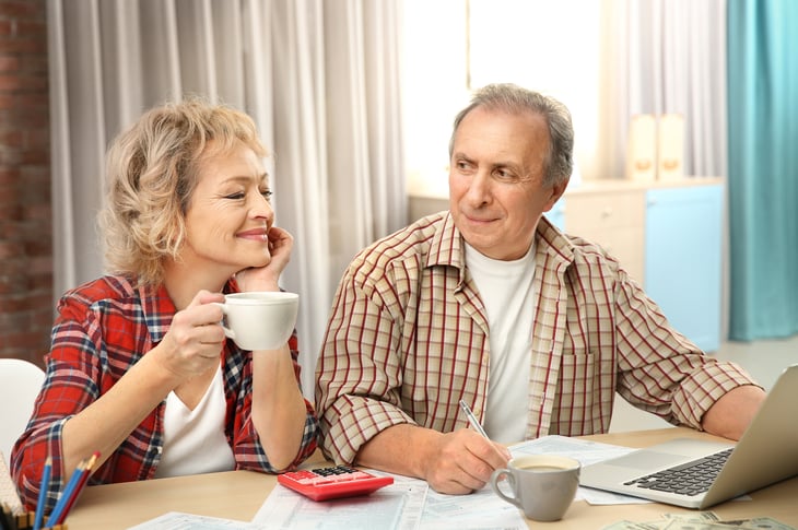 Senior couple works on taxes